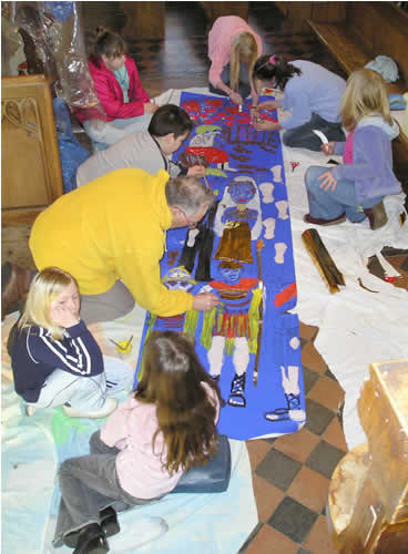 PHOTO: Sparks working on a giant banner depicting the story of St Valentine